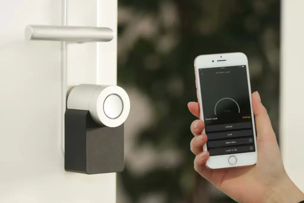 A smartphone controlling a smart lock, demonstrating smart home solutions for enhanced security