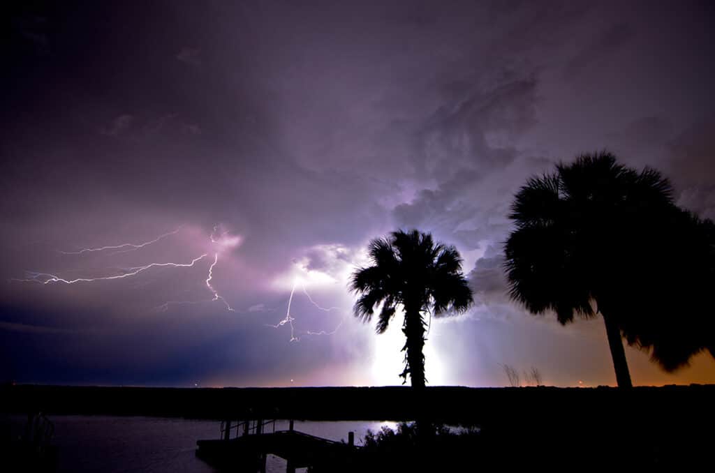 Tropical storm rolling over the sea near Cairns, QLD, showcasing Cairns energy resilience during the wet season.