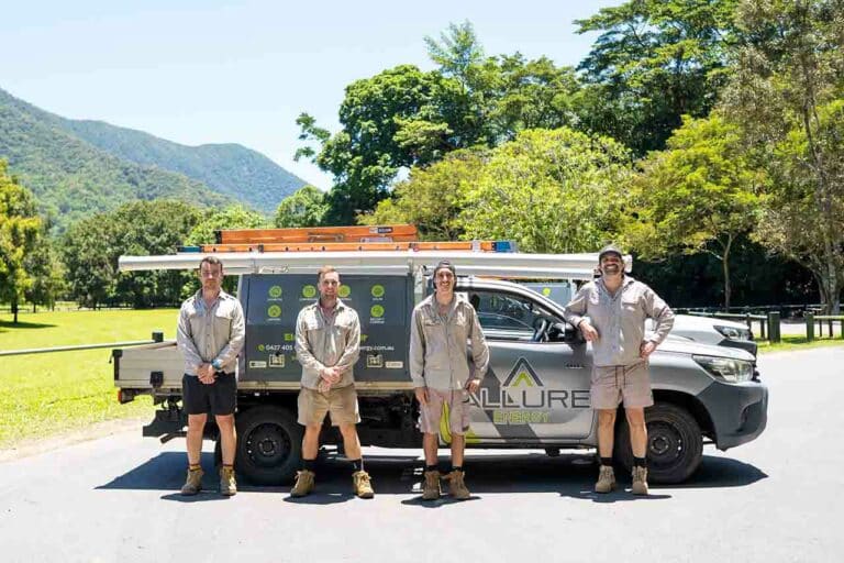 Allure Energy commercial electricians standing beside branded service ute in Cairns QLD