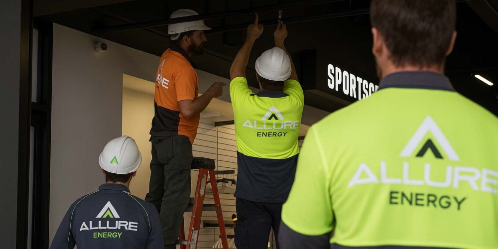 Allure Energy commercial electricians installing lighting during a retail shop fitout in Cairns