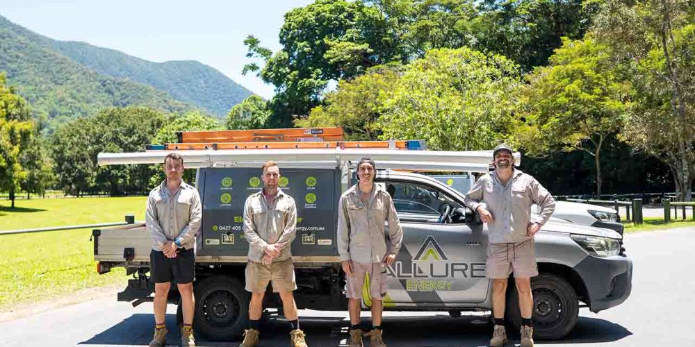 Allure Energy commercial electricians standing beside branded service ute in Cairns QLD